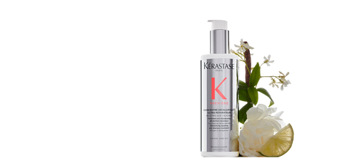 Kerastase Premiere hair treatment surrounded by floral and citrus elements