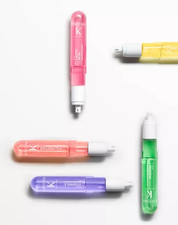 5 Fusio-Dose hair treatment bottles on a white background