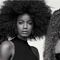 3 models with curly hair with a black and white effect