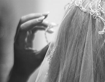 Model wearing a wedding veil with a black and white effect