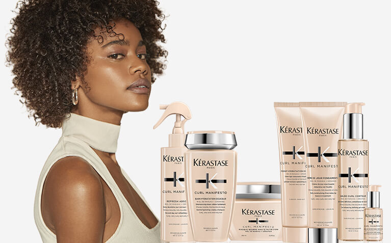 Kerastase Curl Manifesto model with products for curly and coily hair.