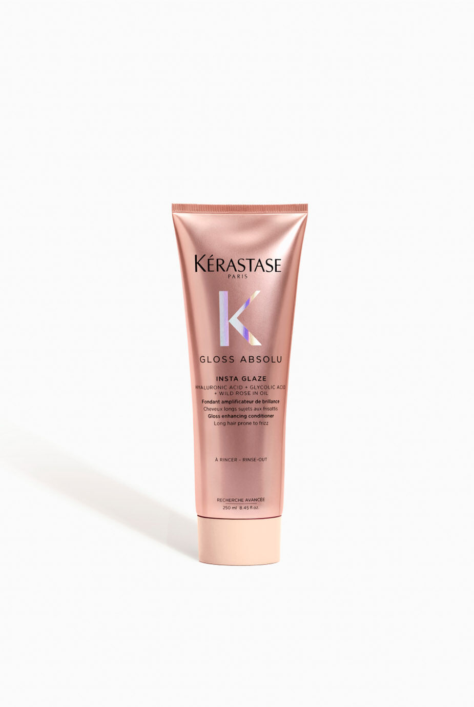 Kerastase Gloss Absolu Conditioner tube on white background