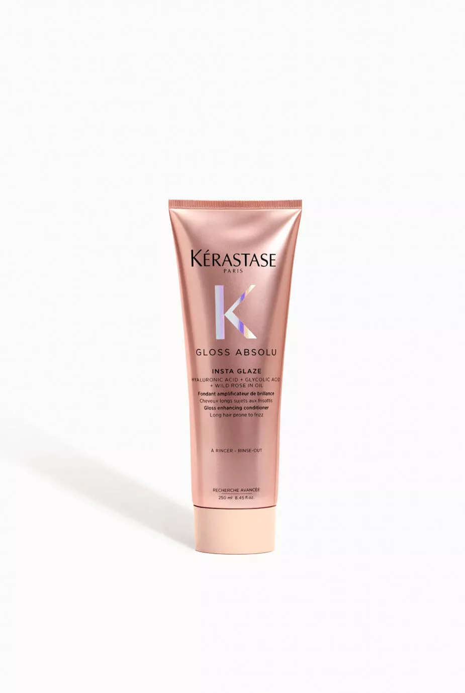 Kerastase Gloss Absolu Conditioner tube on white background