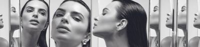 Monochrome portrait of woman with sleek hair reflected in mirrors