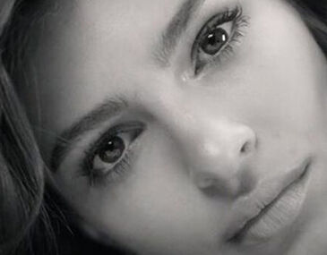Banner with Emily Ratajkowski's face zoomed in with black and white effect