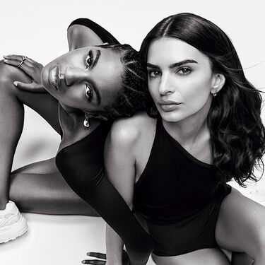 2 models sitting on the ground with monochromatic effect