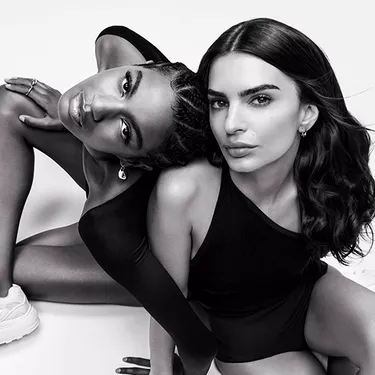 2 models sitting on the ground with monochromatic effect