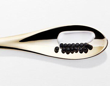 Gold spoon with black pearls and cream from Kerastase Chronologiste