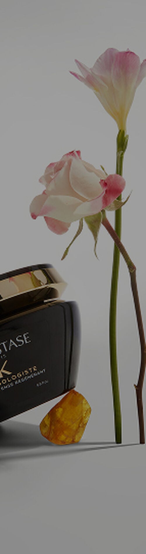 Kerastase Chronologiste Intense Regenerant Hair Mask with rose and amber next to the container