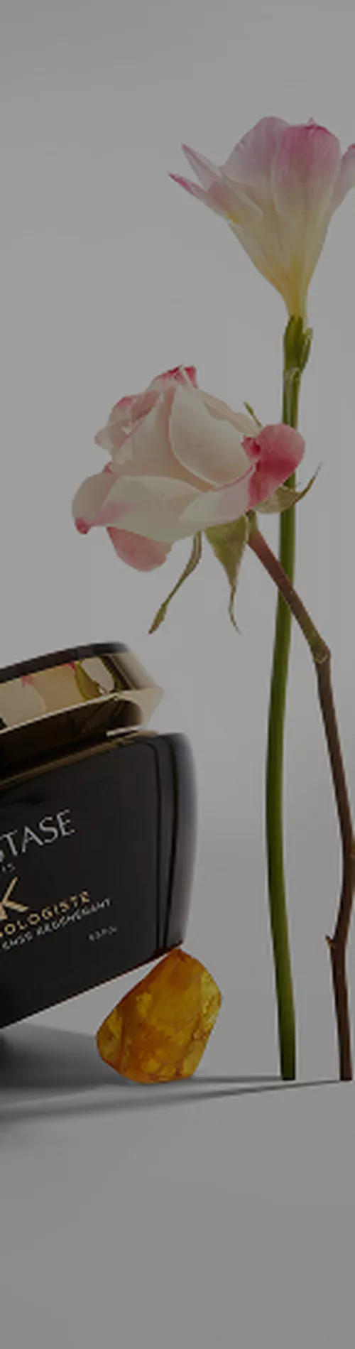 Kerastase Chronologiste Intense Regenerant Hair Mask with rose and amber next to the container