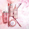 Kerastase Chroma Absolu hair care collection on pink marble background