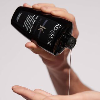 Kerastase Bain Densite Homme Densifique Shampoo to increase hair density product in hand
