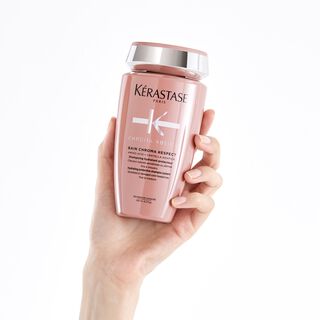 Kerastase Bain Chroma Respect Chroma Absolu Shampoo for colored hair product in hand