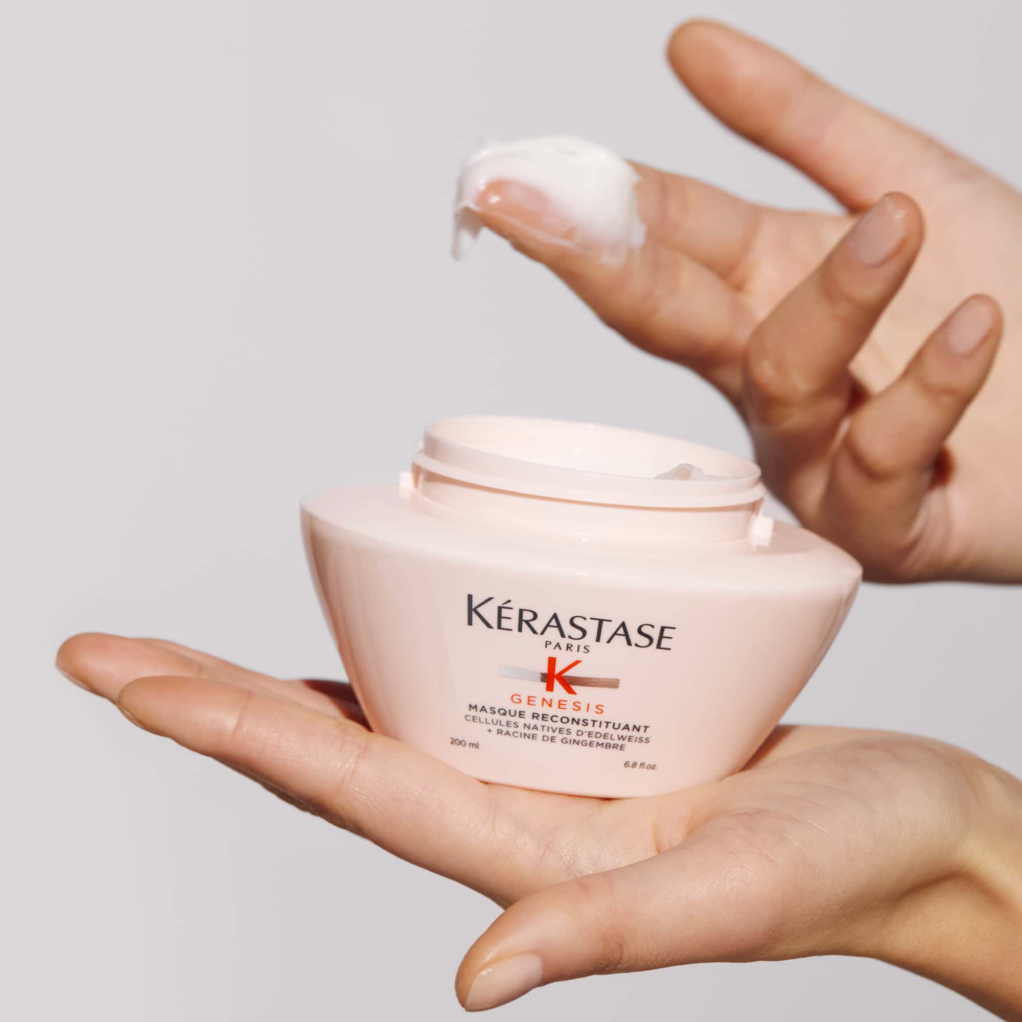 Kerastase Masque Reconstituant Genesis Treatment to fortify hair product in hand