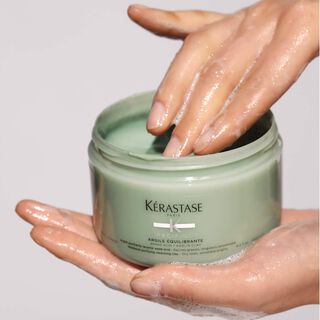 Kerastase Argile Divalent Specifique Treatment for balanced scalp product in hand