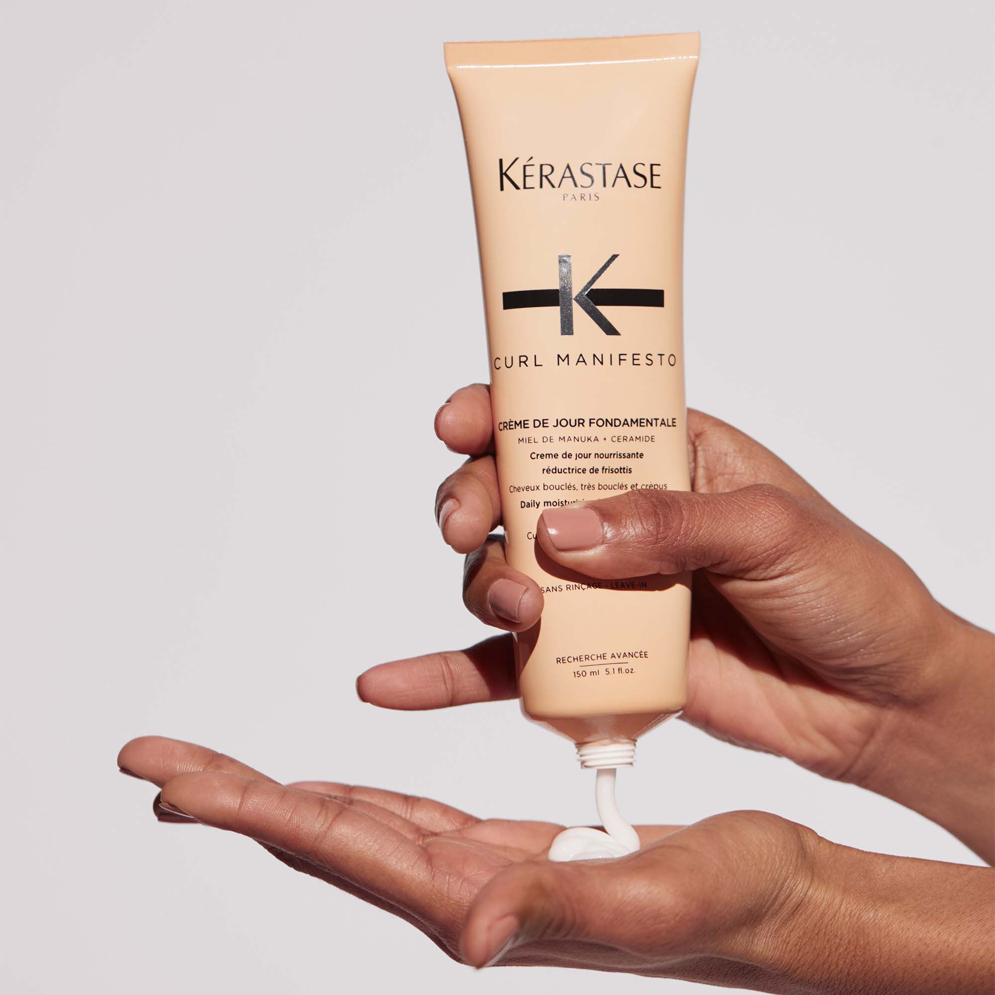 Kerastase Creme de Jour Fondamentale Curl Manifesto Styling for curly hair product in hand
