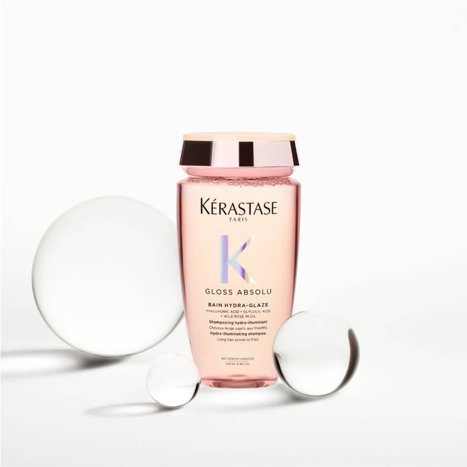 Kerastase Gloss Absolu Shampoo bottle surrounded by glass decor